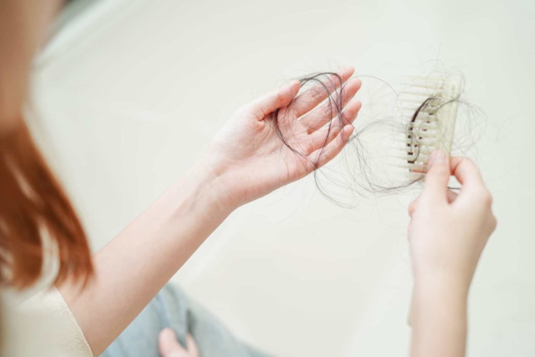 Woman holding outlandish hair