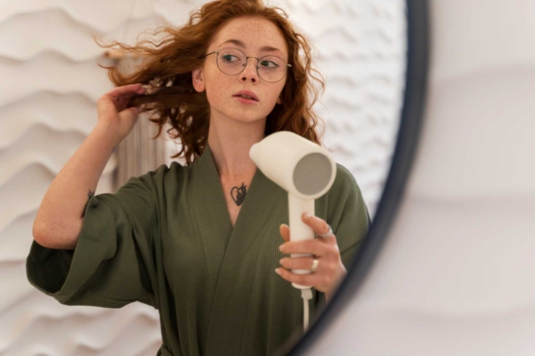 Woman blow drying her hair