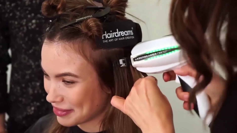 In the middle of the process of hair extension for women with Laserbeamer Nano with Hairdreams bonding extensions